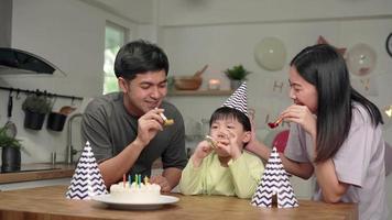 Parents and children playing by blowing toys . Father and mother are hosting a birthday party for their son is 6 years old.. Family activities on holidays. video