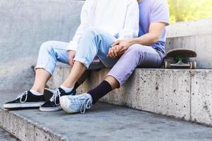 Teenage couple in a skatepark during their date photo