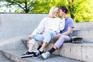 Sensual and loving teenager couple in a skate-park photo