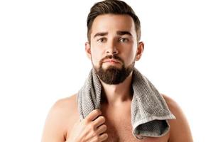 Young and handsome bearded man with smooth skin photo