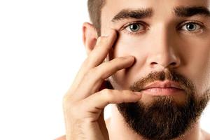 Young and handsome bearded man with smooth skin photo