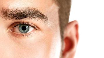 Closeup of healthy male eye photo