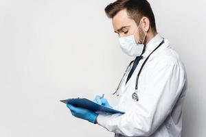 Doctor is holding the clipboard with a documents photo