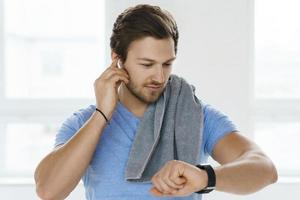 Young and handsome man after fitness workout in the gym photo