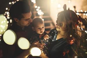 Happy mother and her cute little son are celebrating Christmas or New year. photo