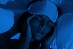 Young woman with a headache and insomnia photo