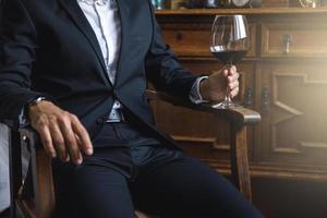 Man with a glass of red wine photo