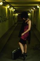 Strange and freaky woman in the dark tunnel photo