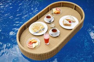 Delicious floating breakfast in the swimming pool photo