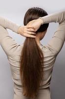 Young woman showing her healthy natural hair photo