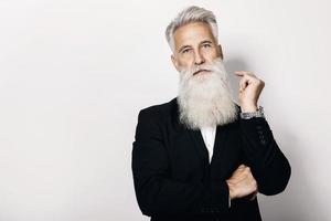 Handsome aged man wearing stylish black suit photo