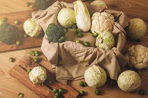 A lot of different cabbages in the wooden box photo