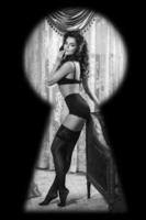 Watching through the keyhole on woman wearing lingerie photo