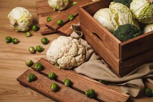 A lot of different cabbages in the wooden box photo