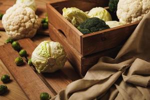 A lot of different cabbages in the wooden box photo