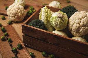 A lot of different cabbages in the wooden box photo