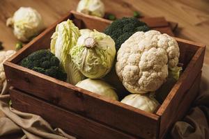 A lot of different cabbages in the wooden box photo