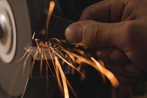 Close-up of bench grinder machine in workshop photo