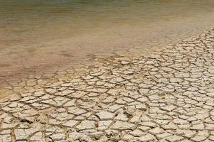 Dry lake bed. Drought ground with cracks. photo