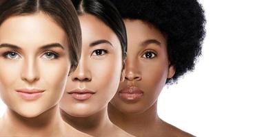 Different ethnicity women - Caucasian, African, Asian on white photo