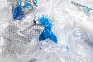 Background with a piile of different plastic waste photo