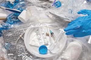 Background with a piile of different plastic waste photo