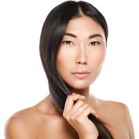 Asian woman with a healthy black hair photo