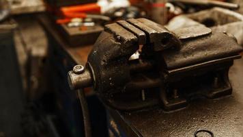 Old and bench vise in the workshop photo