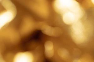 Out of focus golden metallic background photo