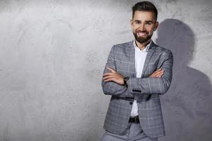 Handsome bearded man wearing gray checkered suit photo