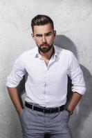 Portrait of handsome bearded man wearing white shirt photo