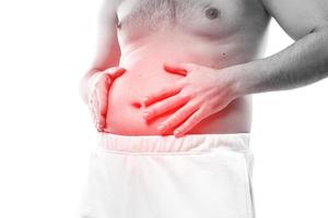 Man is suffering from problems with a digestion photo