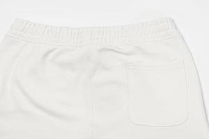 textura de tela de algodón de un pantalón de chándal blanco foto