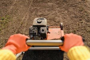 Close-up of aerator machine in the meadow photo