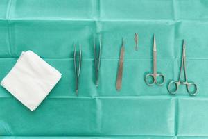 Surgical stainless steel tools in operating room photo