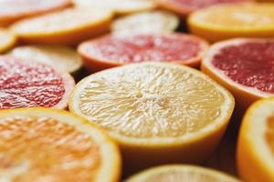 Closeup of different sliced citrus fruits photo