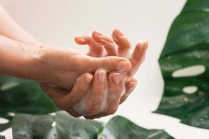 Closeup of female hands with cleansing foam photo