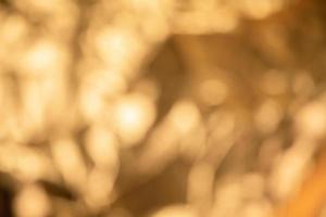 Abstract out of focus golden metallic background photo