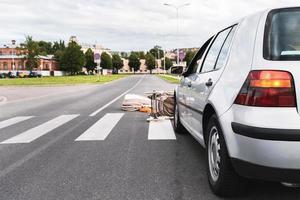 Car accident on the crosswalk. Vehicle hits the baby pram. photo