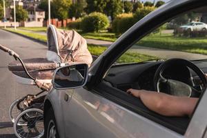 Vehicle hits the baby pram on the road because of jaywalking photo