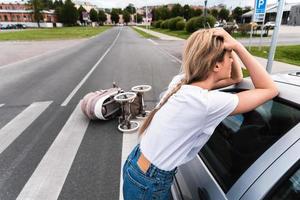 Horrified driver after a car accident with baby pram on the crosswalk photo