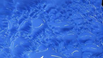 Blue bright beautiful flowing water, blue colored liquid. Abstract background. Video in high quality 4k, motion graphics design