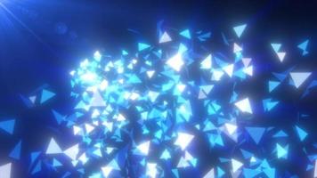 Abstract flying small blue luminous fragments bright glass triangles particles shiny energetic magical on a dark background. Abstract background. Video in high quality 4k, motion design