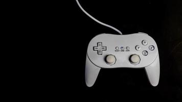 white joystick isolated black background photo