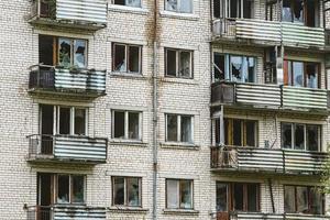 Exterior of abandoned apartment building in european ghost town. photo