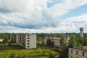 Exterior of abandoned apartment buildings in european ghost town. photo