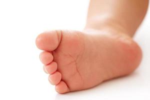 Closeup shot of little child foot and sole. photo