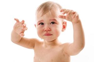 Closeup shot of upset little boy crying. photo