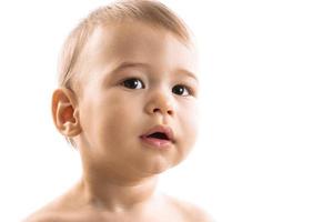 Closeup shot of curious little boy face. photo