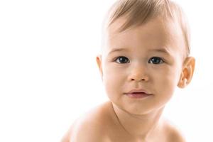 Closeup shot of curious little boy face. photo